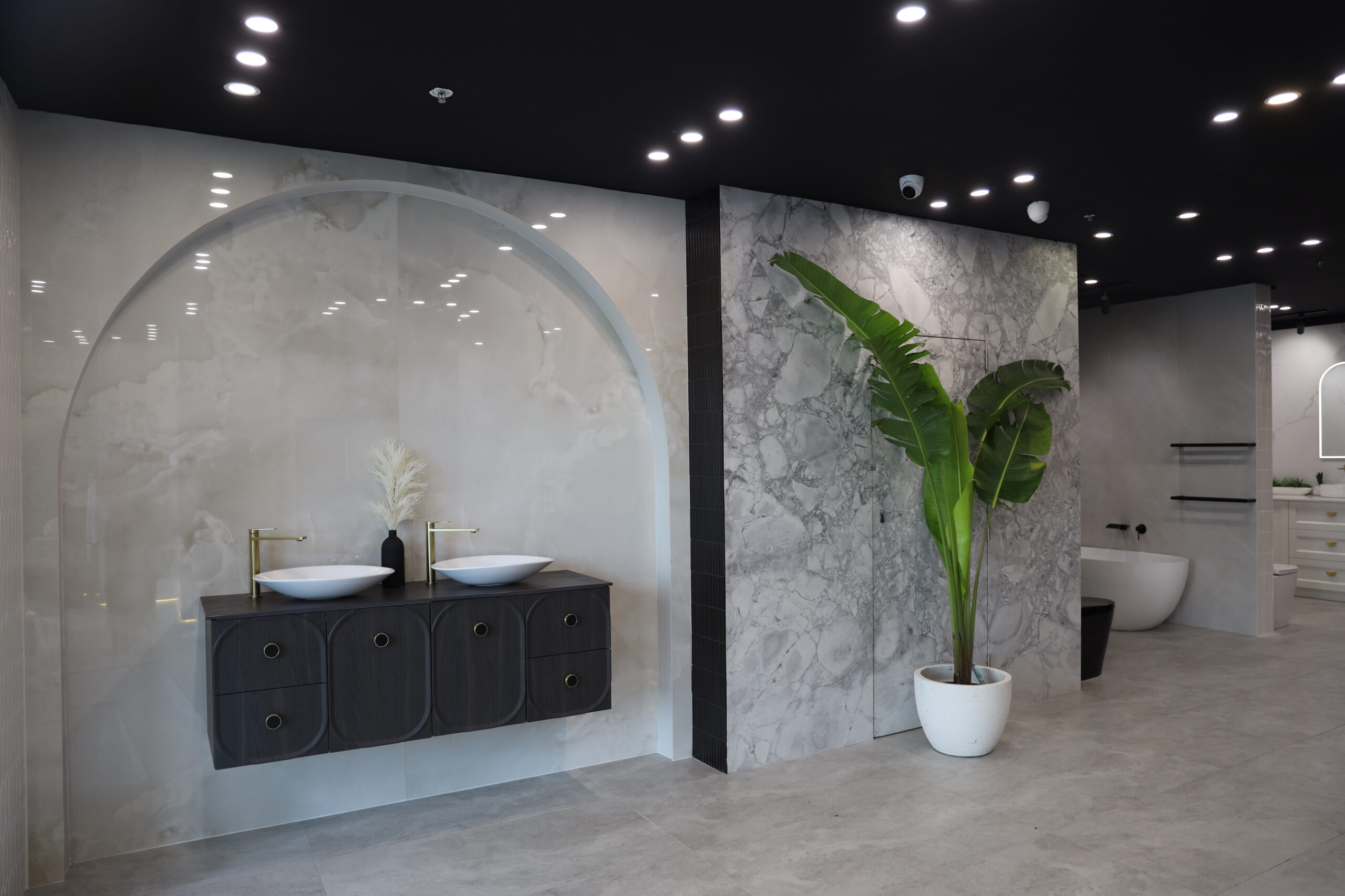 “Luxurious modern bathroom renovation featuring sleek black fixtures, custom cabinetry, and a walk-in shower by Mi Casa Bathrooms in Sydney